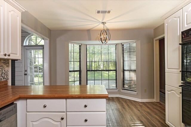 1309 Frontier, White Hall, AR 71602 - kitchen featuring dark wood finished floors, decorative light fixtures, white cabinets, baseboards, and wood counters