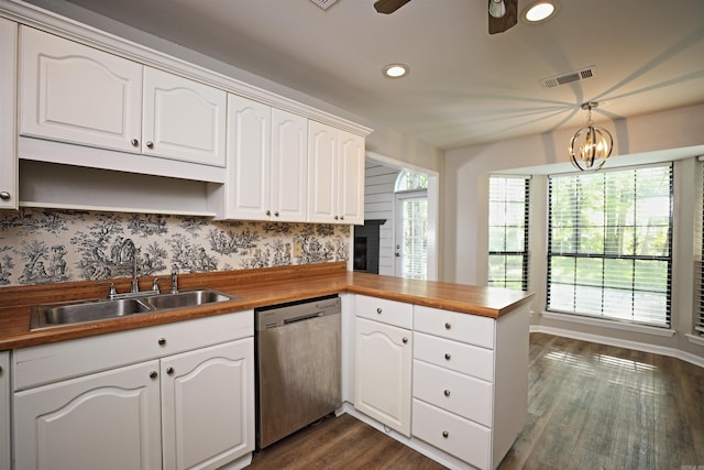 1309 Frontier, White Hall, AR 71602 - kitchen with stainless steel dishwasher, a sink, a peninsula, dark wood-type flooring, and recessed lighting