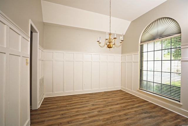 1309 Frontier, White Hall, AR 71602 - unfurnished dining area with a decorative wall, a chandelier, dark wood finished floors, vaulted ceiling, and a wainscoted wall