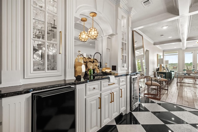 130 Grand Isle Dr Unit 1D, Hot Springs, AR 71913 - bar featuring ornamental molding, a chandelier, beverage cooler, a sink, and hanging light fixtures