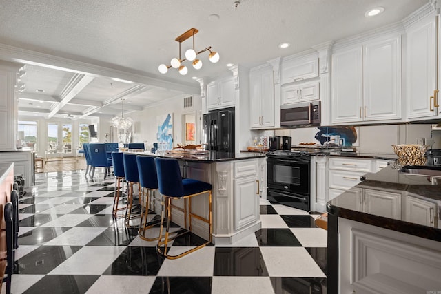 130 Grand Isle Dr Unit 1D, Hot Springs, AR 71913 - kitchen with black appliances, coffered ceiling, light flooring, dark countertops, and beam ceiling