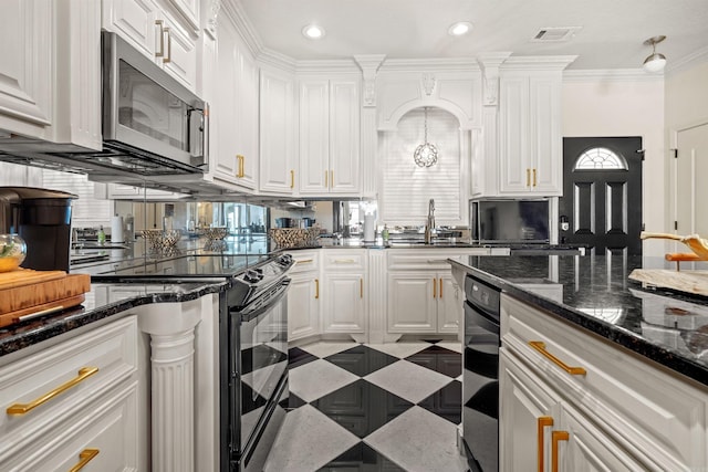 130 Grand Isle Dr Unit 1D, Hot Springs, AR 71913 - kitchen with stainless steel microwave, black range with electric stovetop, white cabinetry, a sink, and recessed lighting