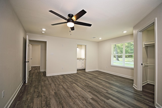 904 W Holland, White Hall, AR 71602 - unfurnished bedroom with dark wood-type flooring, recessed lighting, baseboards, a ceiling fan, and connected bathroom