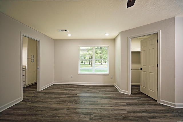 904 W Holland, White Hall, AR 71602 - unfurnished bedroom featuring dark wood-style flooring, baseboards, ceiling fan, and recessed lighting