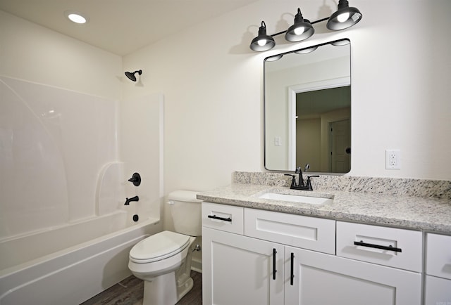 904 W Holland, White Hall, AR 71602 - full bath with vanity, toilet, shower / bathtub combination, and wood finished floors