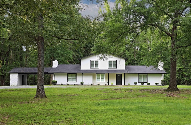 904 W Holland, White Hall, AR 71602 - view of front of property with a chimney, a front yard, a porch, an attached carport, and roof with shingles