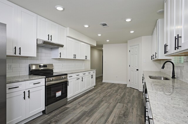 904 W Holland, White Hall, AR 71602 - kitchen with stainless steel electric range, a sink, under cabinet range hood, white cabinetry, and recessed lighting