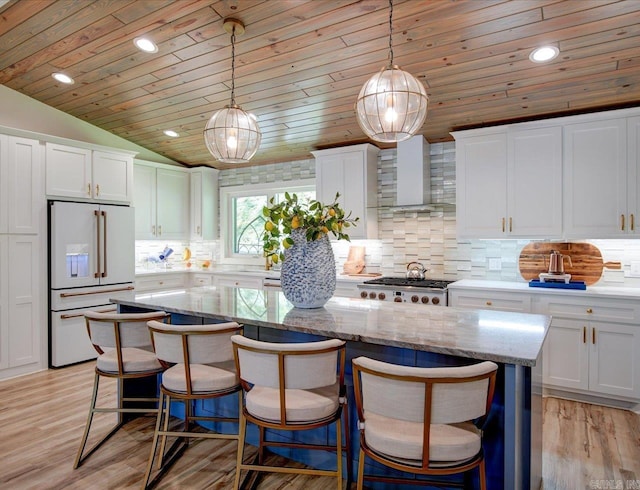 366-370 Restful Ridge Rd, Hot Springs, AR 71913 - kitchen featuring high end white fridge, wall chimney range hood, white cabinets, backsplash, and recessed lighting