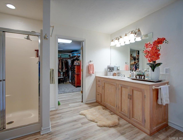 366-370 Restful Ridge Rd, Hot Springs, AR 71913 - bathroom featuring a spacious closet, vanity, and a stall shower