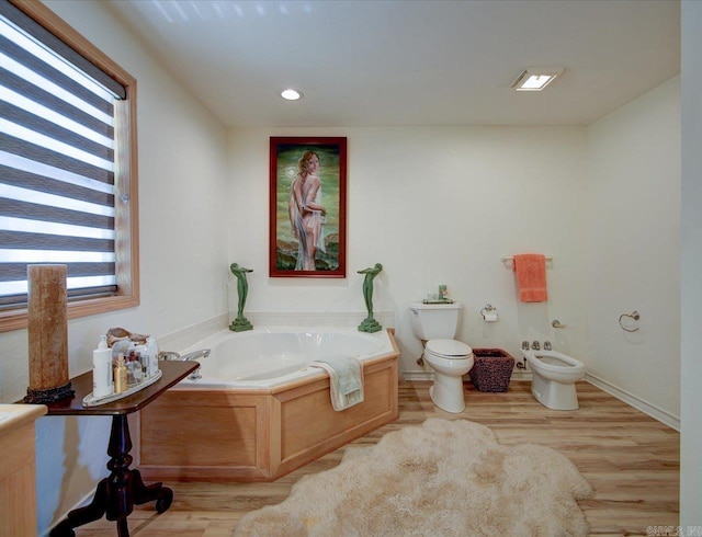 366-370 Restful Ridge Rd, Hot Springs, AR 71913 - full bath featuring toilet, a bidet, a bath, wood finished floors, and recessed lighting