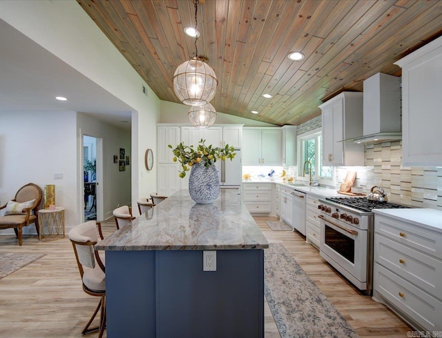 366-370 Restful Ridge Rd, Hot Springs, AR 71913 - kitchen featuring white appliances, wall chimney range hood, a center island, tasteful backsplash, and a kitchen bar