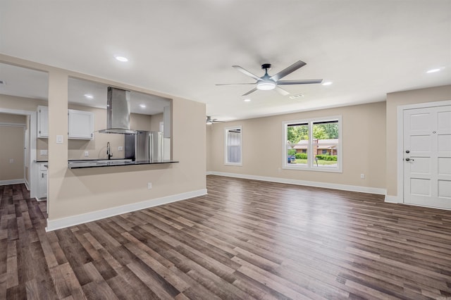 1907 Creekwood Dr, Conway, AR 72032 - unfurnished living room with ceiling fan, dark wood-style flooring, baseboards, and recessed lighting