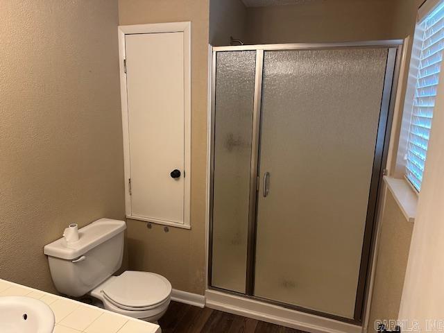 1 Rogers Dr, Morrilton, AR 72110 - full bath with a shower stall, toilet, wood finished floors, baseboards, and vanity