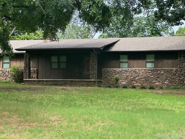 1 Rogers Dr, Morrilton, AR 72110 - ranch-style home with stone siding, roof with shingles, and board and batten siding