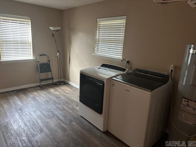 1 Rogers Dr, Morrilton, AR 72110 - washroom with independent washer and dryer, water heater, wood finished floors, and baseboards