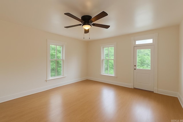 1617 Maple St, North Little Rock, AR 72114 - spare room featuring wood finished floors, healthy amount of natural light, baseboards, and a ceiling fan