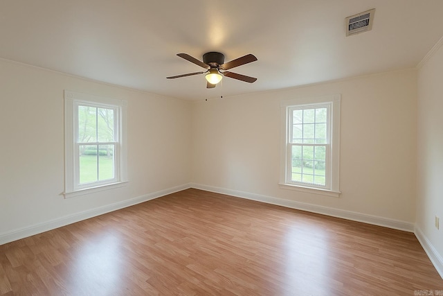 1617 Maple St, North Little Rock, AR 72114 - unfurnished room with ornamental molding, light wood finished floors, baseboards, and ceiling fan