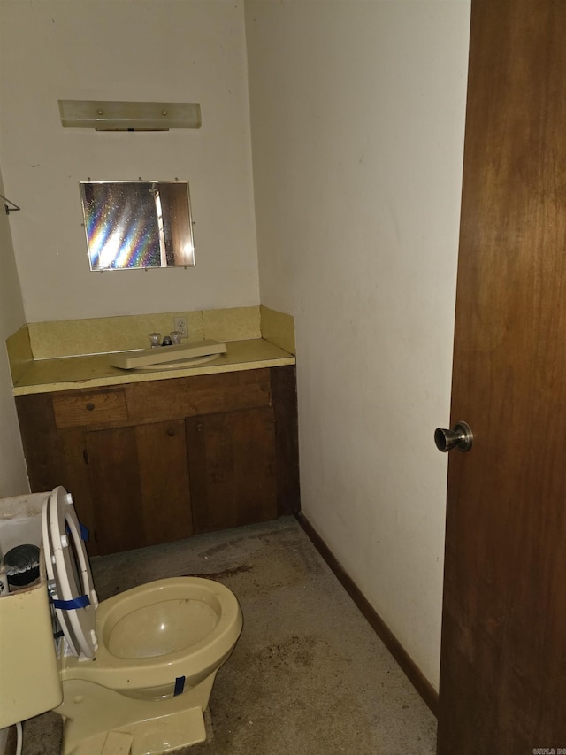 85 Bailey Rd, Morrilton, AR 72110 - half bathroom featuring vanity, toilet, and baseboards