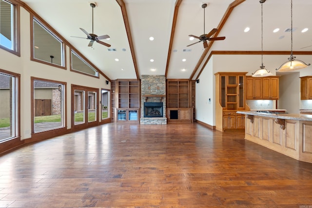 261 Peninsula Dr, Hot Springs, AR 71901 - unfurnished living room with ceiling fan, high vaulted ceiling, a fireplace, dark wood finished floors, and beamed ceiling