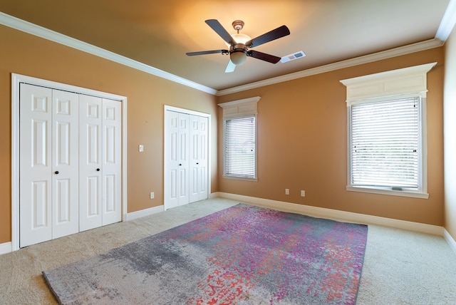 261 Peninsula Dr, Hot Springs, AR 71901 - unfurnished bedroom featuring carpet, ornamental molding, two closets, and baseboards