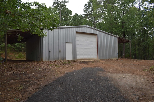 10355 Rodeo Rd, Belleville, AR 72824 - garage featuring a detached garage and dirt driveway