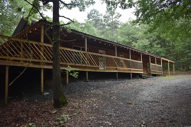 10355 Rodeo Rd, Belleville, AR 72824 - back of property with a deck and metal roof