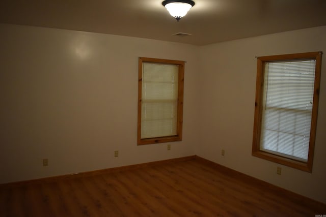 10355 Rodeo Rd, Belleville, AR 72824 - empty room featuring wood finished floors and baseboards