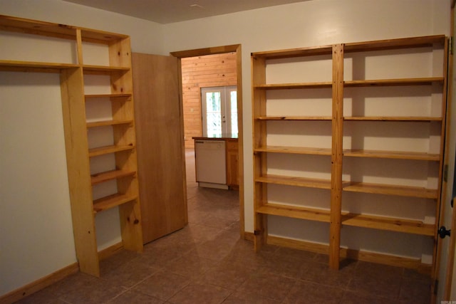 10355 Rodeo Rd, Belleville, AR 72824 - spacious closet with dark tile patterned flooring and french doors