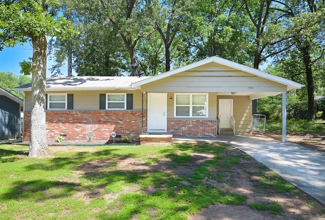 7710 Bradley Dr, Little Rock, AR 72209 - view of front facade with brick siding, a carport, driveway, and a front yard