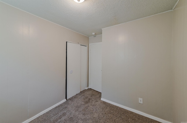7710 Bradley Dr, Little Rock, AR 72209 - spare room with carpet floors, a textured ceiling, and ornamental molding