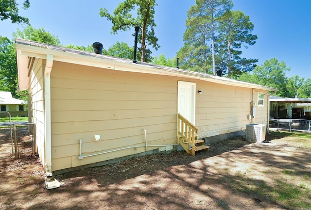 7710 Bradley Dr, Little Rock, AR 72209 - rear view of property with entry steps and central air condition unit