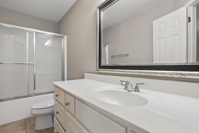 7106 Ohio St Unit 6, Little Rock, AR 72207 - full bathroom featuring toilet, vanity, tile patterned flooring, and shower / bath combination with glass door