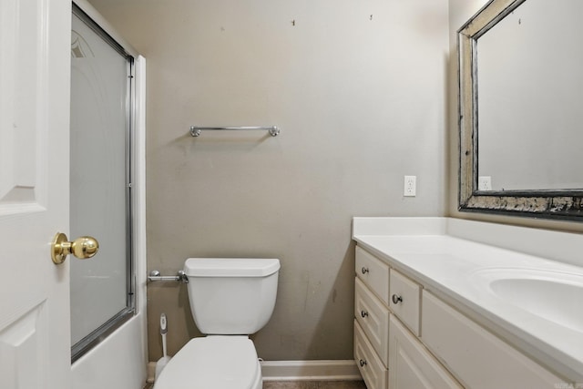 7106 Ohio St Unit 6, Little Rock, AR 72207 - bathroom with vanity, toilet, bath / shower combo with glass door, and baseboards