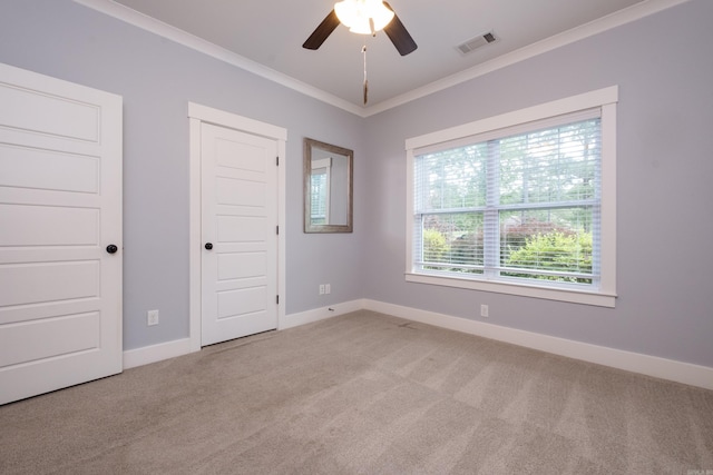 853 Rushing Rd, Little Rock, AR 72210 - unfurnished bedroom with crown molding, light colored carpet, baseboards, a ceiling fan, and a closet