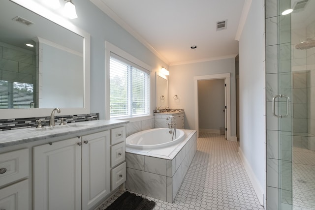 853 Rushing Rd, Little Rock, AR 72210 - full bath with a stall shower, two vanities, ornamental molding, a bath, and baseboards