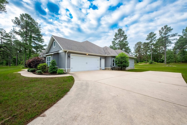 853 Rushing Rd, Little Rock, AR 72210 - view of side of home featuring an attached garage, driveway, a lawn, and a shingled roof
