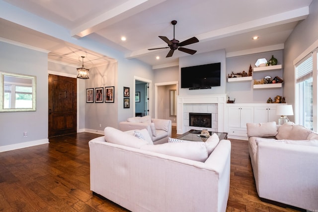 853 Rushing Rd, Little Rock, AR 72210 - living area with beamed ceiling, dark wood finished floors, a tiled fireplace, baseboards, and ceiling fan