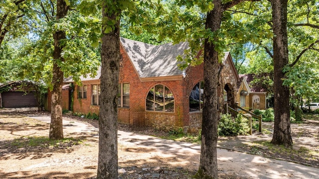 1405 Fair Park Blvd, Little Rock, AR 72204 - english style home with roof with shingles, brick siding, and driveway