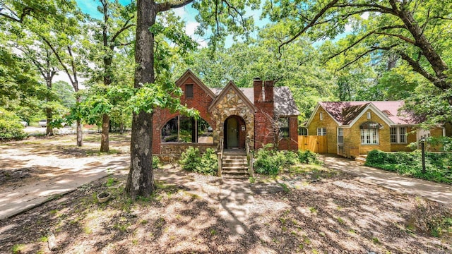 1405 Fair Park Blvd, Little Rock, AR 72204 - english style home featuring a chimney, stone siding, and brick siding
