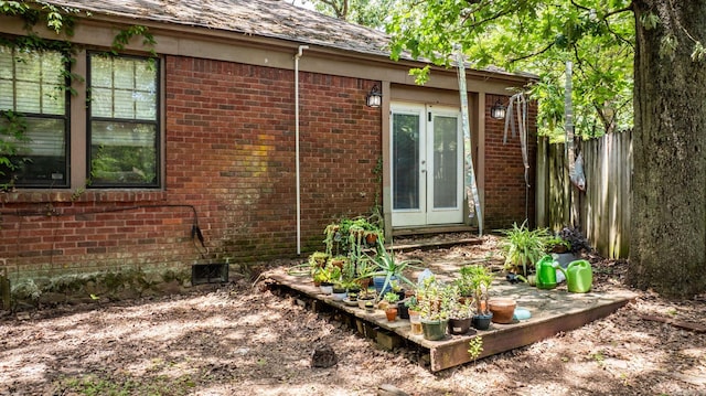 1405 Fair Park Blvd, Little Rock, AR 72204 - view of property exterior featuring brick siding, french doors, and crawl space