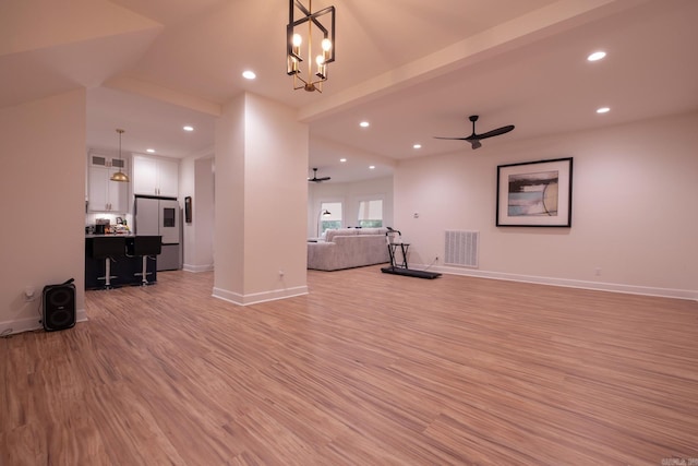 2103 Wolfe St, Little Rock, AR 72202 - unfurnished living room featuring a ceiling fan, light wood-style floors, recessed lighting, baseboards, and a chandelier