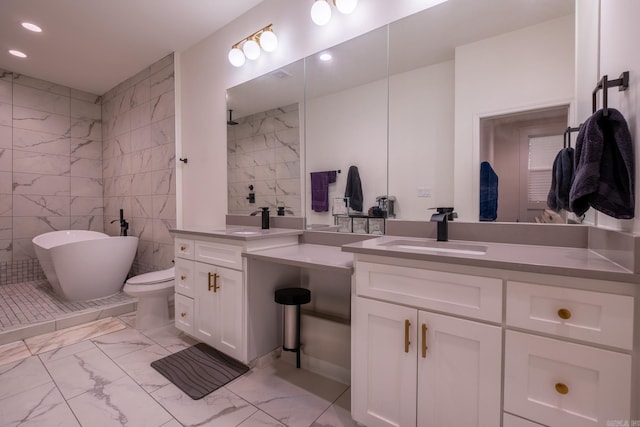 2103 Wolfe St, Little Rock, AR 72202 - bathroom featuring marble finish flooring, a soaking tub, recessed lighting, vanity, and toilet