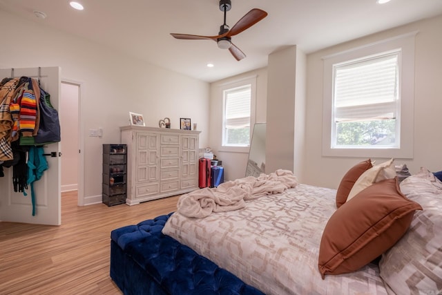 2103 Wolfe St, Little Rock, AR 72202 - bedroom with light wood finished floors, recessed lighting, ceiling fan, and baseboards