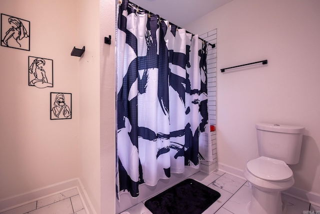 2103 Wolfe St, Little Rock, AR 72202 - bathroom with marble finish floors, baseboards, toilet, and shower / tub combo