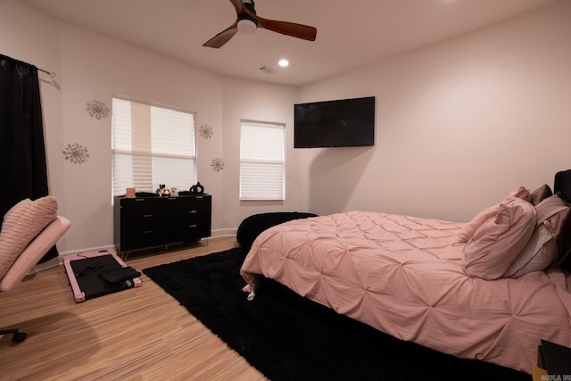 2103 Wolfe St, Little Rock, AR 72202 - bedroom with wood finished floors, recessed lighting, ceiling fan, and baseboards