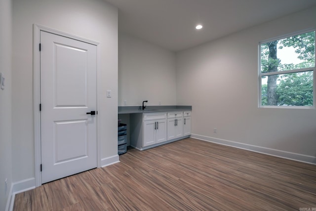 2103 Wolfe St, Little Rock, AR 72202 - bar area with wood finished floors, baseboards, recessed lighting, and a sink