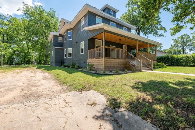 2103 Wolfe St, Little Rock, AR 72202 - view of front of house with covered porch, a front yard, and stairs