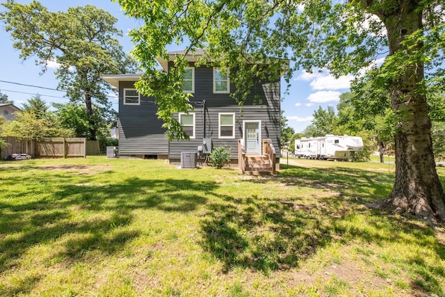 2103 Wolfe St, Little Rock, AR 72202 - rear view of property with central air condition unit and entry steps