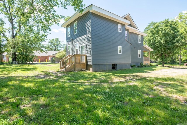 2103 Wolfe St, Little Rock, AR 72202 - rear view of house featuring a yard