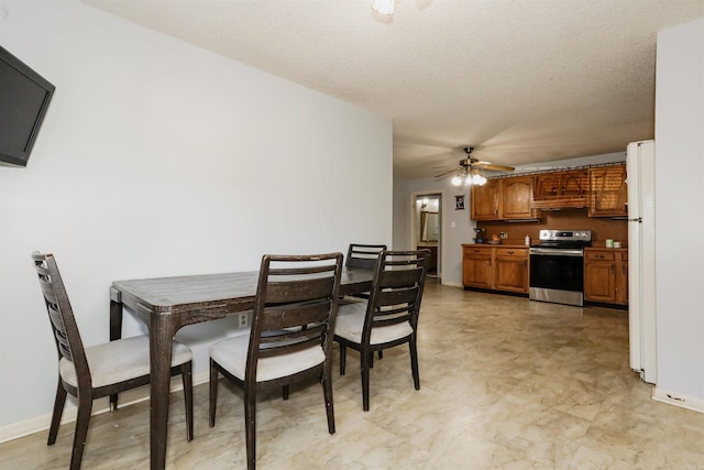 200 Sonnet St, Hot Springs, AR 71913 - dining room with a ceiling fan, a textured ceiling, baseboards, and light floors